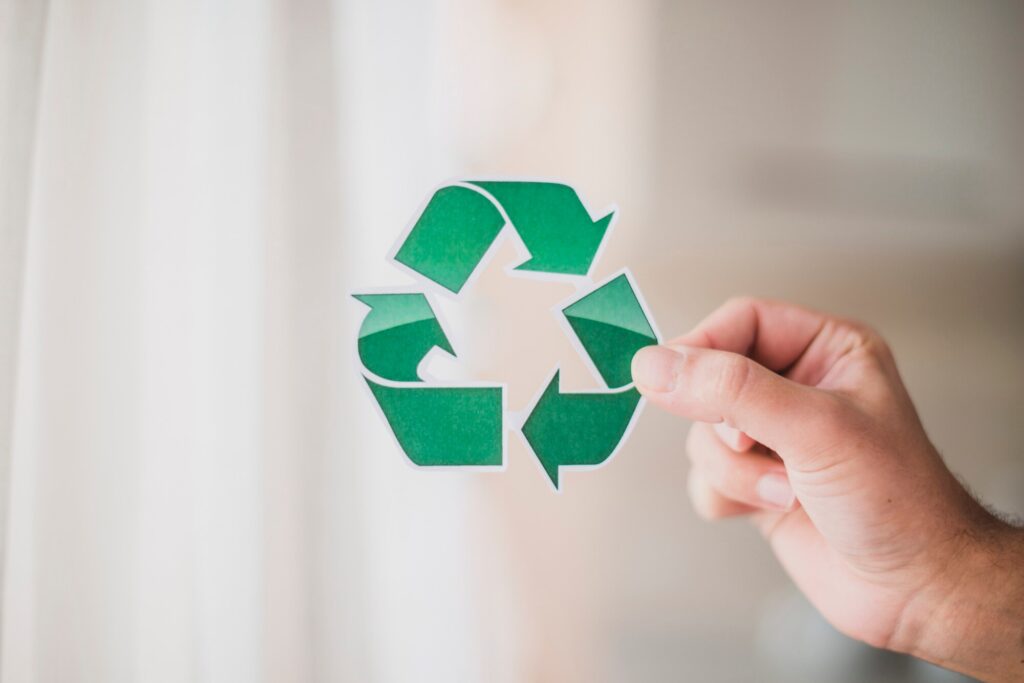man-s-hand-showing-recycle-icon_23-2147817183